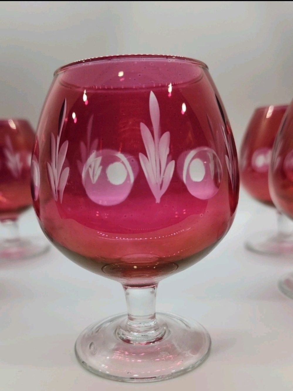 Vintage cognac/brandy glasses cranberry to clear cut design clear stem Set of 5
